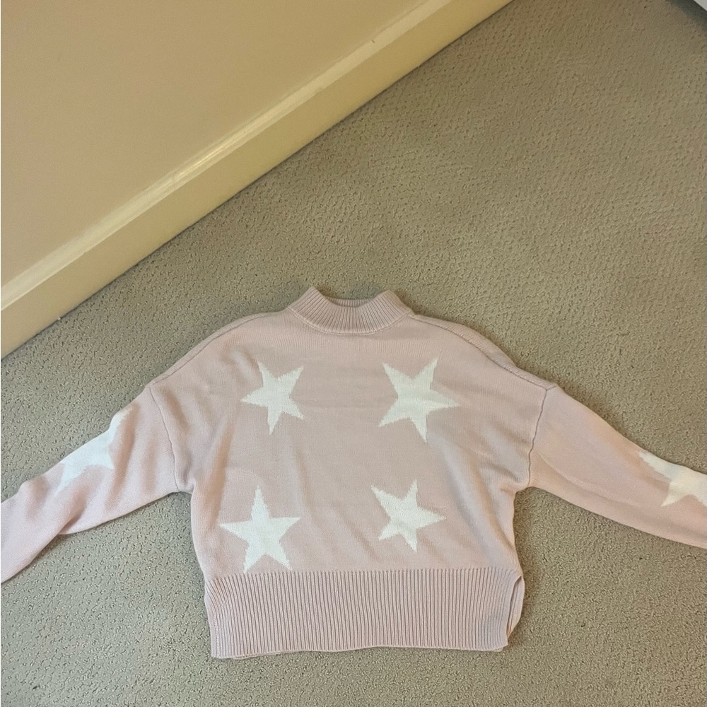 pink sweater with white stars